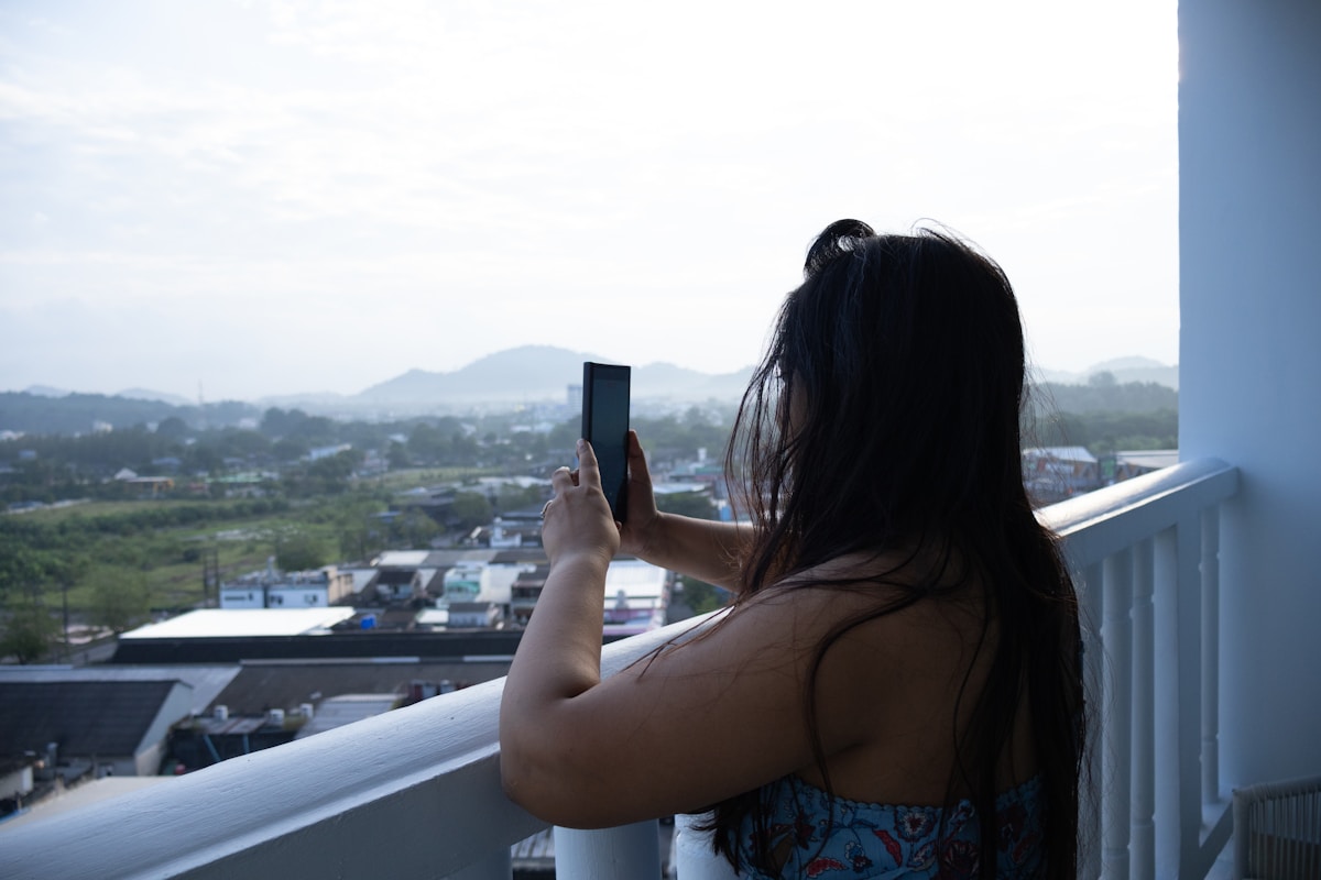 A hotel guest photographing the view from her balcony — the kind of source asset no AI tool can generate